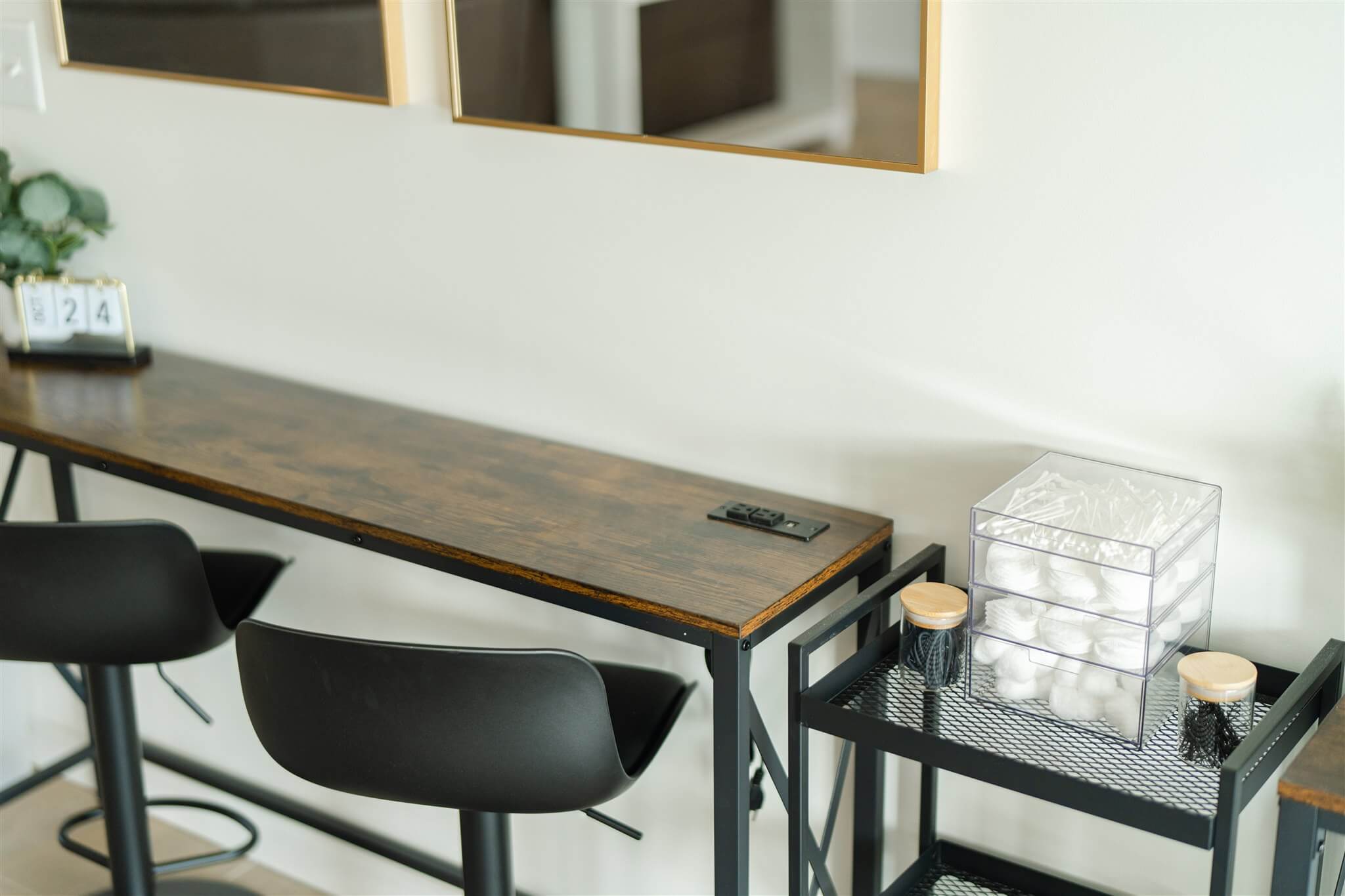 Beauty station supplies with cotton rounds and stools in the Glam Suite
