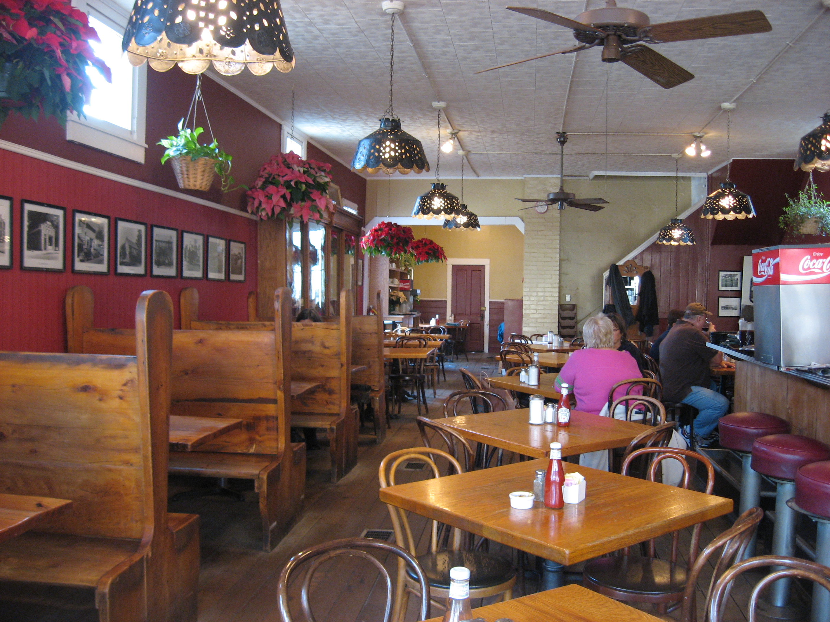 Cozy diner interior with wooden booths and tables
