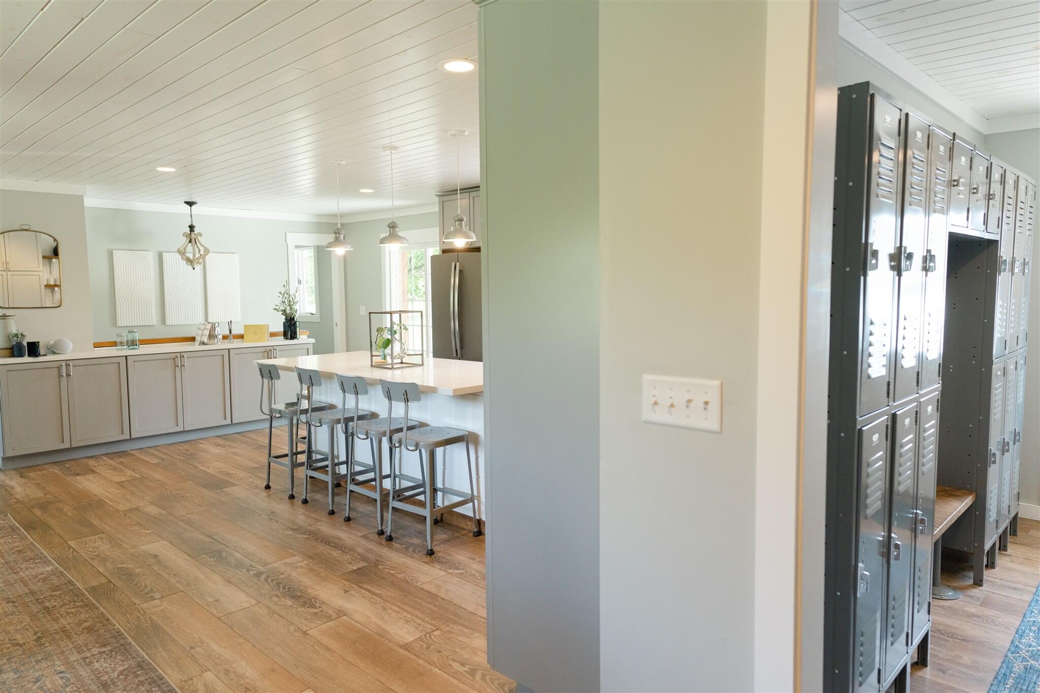 Open kitchen and locker area with barstool seating